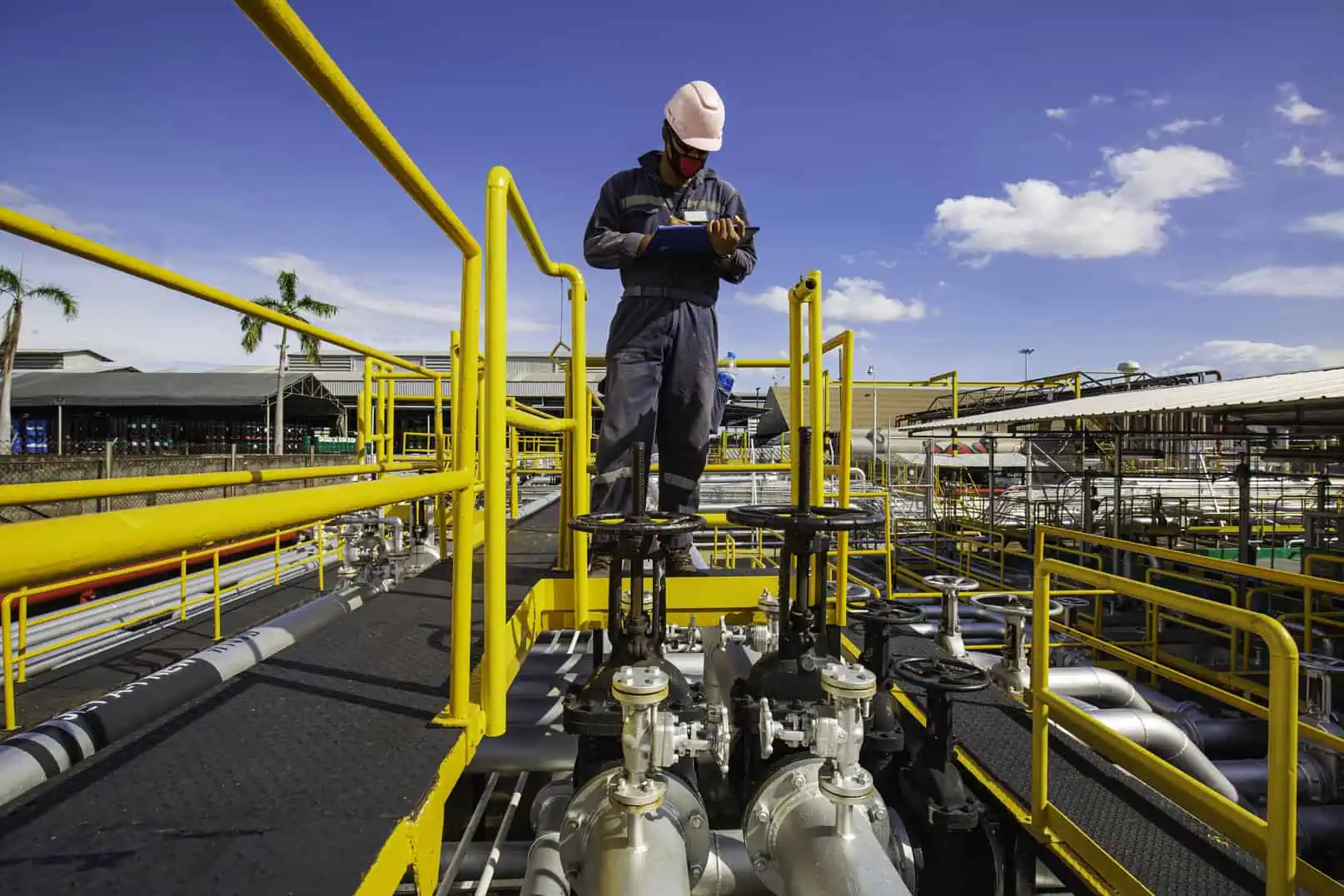 Man Standing Near Gray Metal Equipment